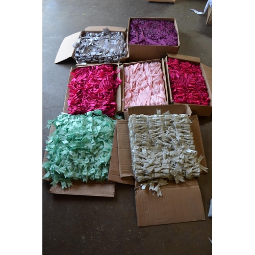 151 - 7 BOXES OF VARIOUS COLOURED RIBBONS AND BOWS