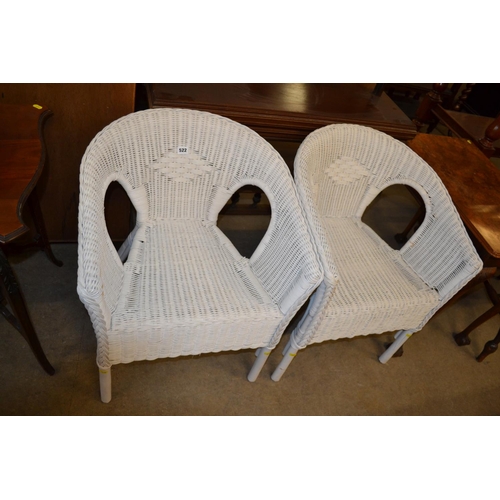 522 - PAIR OF WHITE CANE ARMCHAIRS