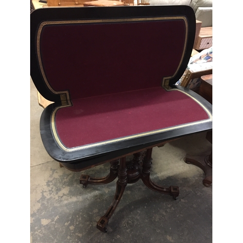 496 - VICTORIAN BURR WALNUT AND EBONISED INLAID FOLD TOP GAMES TABLE ON 4 TURNED PILLAR SUPPORTS, SHAPED L... 