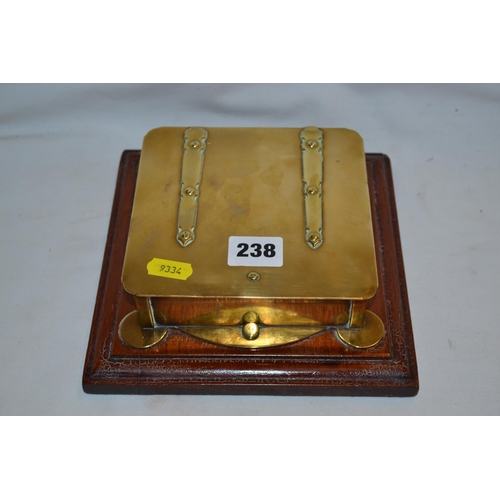 238 - ARTS AND CRAFTS BRASS BOX WITH STRAPWORK DECORATION, SECRET OPENING MECHANISM, ON BRASS BASE