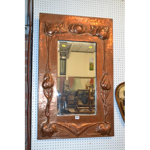 477 - LARGE ART NOUVEAU BEVELLED WALL MIRROR IN EMBOSSED COPPER FRAME WITH STYLISED FLOWER DECORATION 59cm... 