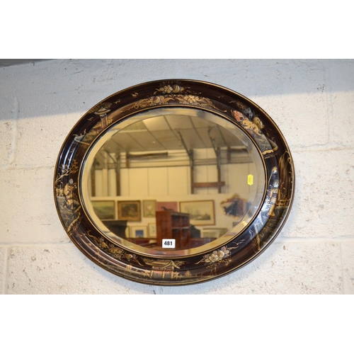 481 - 19TH CENTURY OVAL BEVELLED WALL MIRROR IN DEEP BLACK LACQUERED AND CHINOISERIE DECORATED FRAME