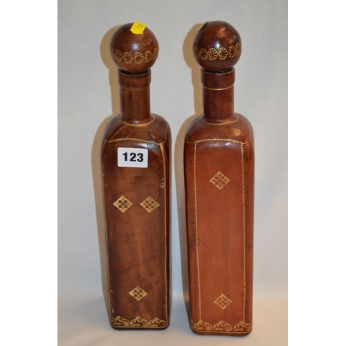 123 - PAIR OF ITALIAN LEATHER COVERED WINE BOTTLES WITH GILDED DECORATION