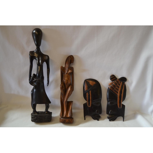 149 - FOUR CARVED HARDWOOD FIGURES OF AFRICAN ART