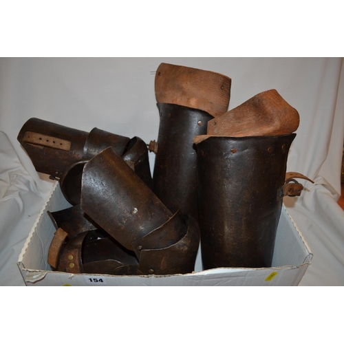 154 - SET OF HEAVY IRON AND LEATHER LEG ARMOUR