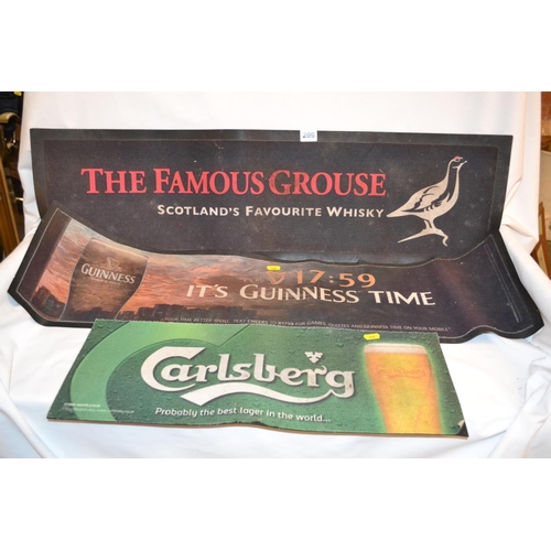 209 - THREE BREWERY RUBBERISED BEER MATS ADVERTISING FAMOUS GROUSE, GUINNESS AND CARLSBERG