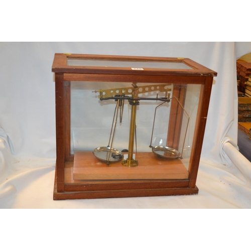 249 - SET OF BRASS LABORATORY SCALES IN GLAZED CASE WITH LIFT UP DOOR