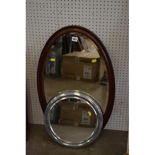 407 - OVAL BEVELLED WALL MIRROR IN MAHOGANY FRAME AND CIRCULAR CHROME FRAMED MIRROR