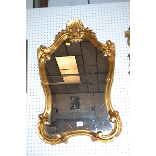 414 - MODERN SHAPED WALL MIRROR IN GILT FRAME