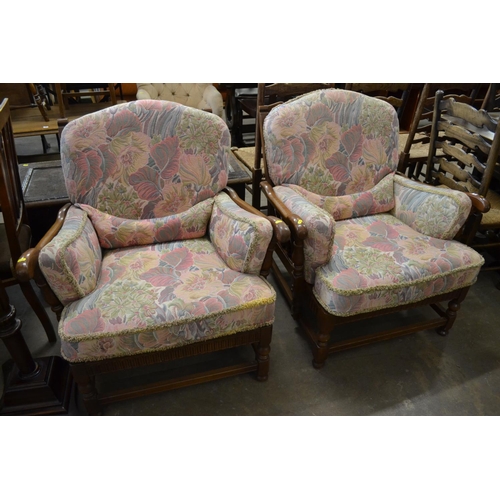 486 - PAIR OF ERCOL OAK ARMCHAIRS WITH LOOSE CUSHIONS