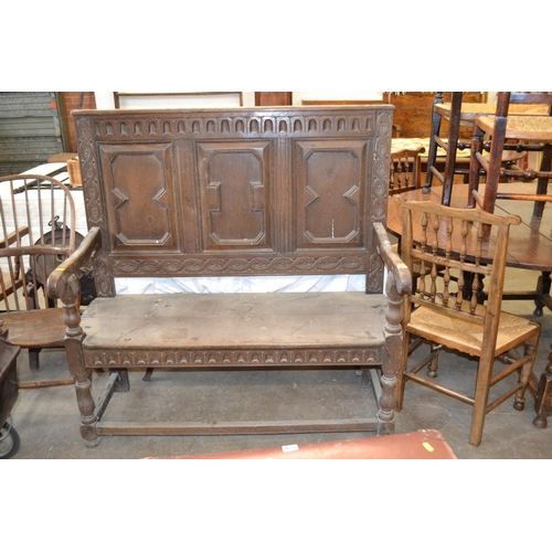 567 - 19TH CENTURY OAK HIGH BACK HALL SETTLE WITH CARVED AND PANELLED BACK, SHAPED ARMS, ON TURNED LEGS AN... 