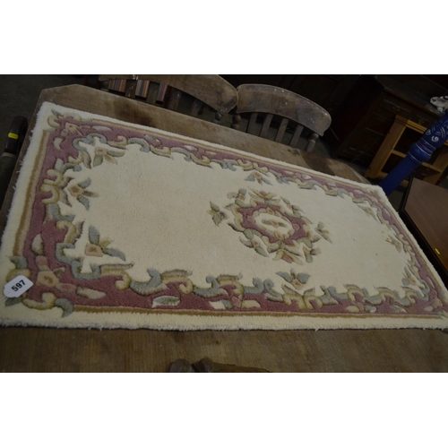 597 - INDIAN HAND TUFTED WOOL RUG 60CM X 120CM