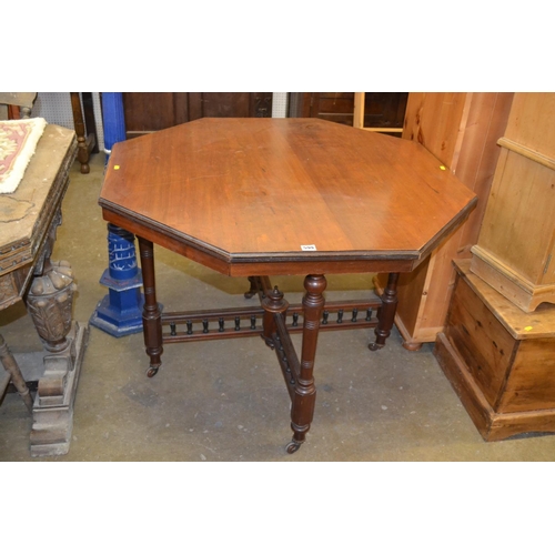 599 - EDWARDIAN OCTAGONAL WALNUT CENTRE TABLE WITH CROSS GALLERIED STRETCHERS