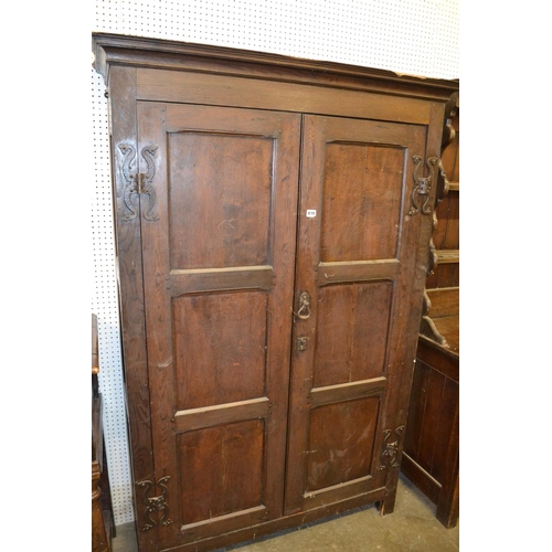 618 - 19TH CENTURY OAK HANGING CUPBOARD WITH PANELLED DOORS AND SHAPED HINGES