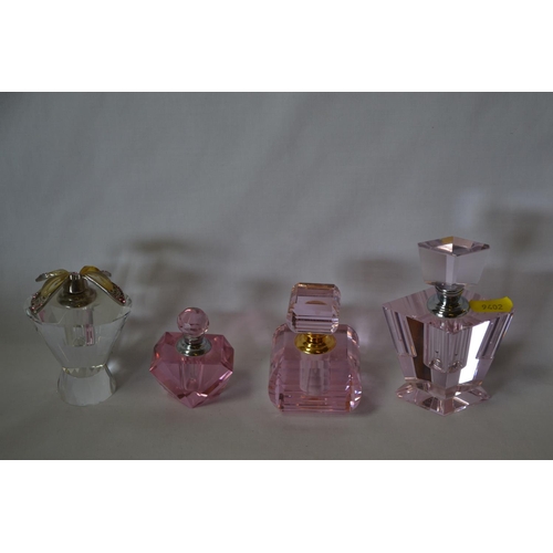 85 - 3 RETRO PINK TINTED SCENT BOTTLES AND 1 CLEAR GLASS SCENT BOTTLE