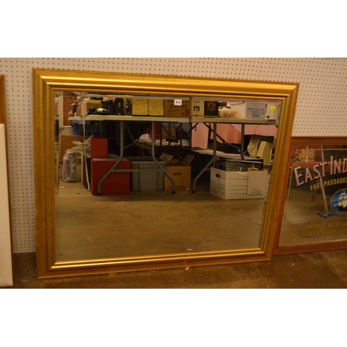 413 - LARGE BEVELLED GLASS WALL MIRROR IN GILT FRAME