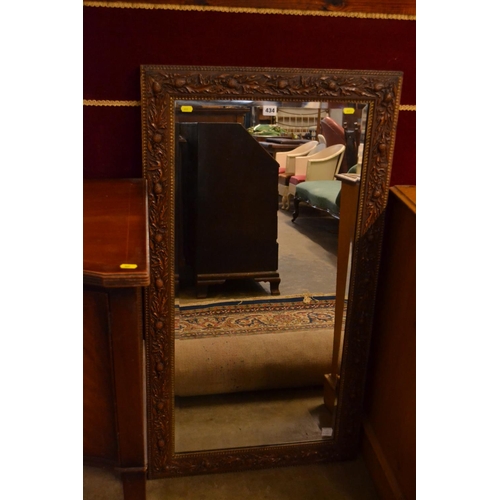 434 - RECTANGULAR BEVELLED WALL MIRROR IN THISTLE DECORATED FRAME 62CM X 113CM