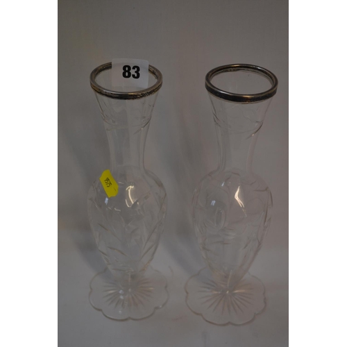 83 - PAIR OF CUT GLASS BUD VASES WITH SILVER RIMS (CHIP TO FOOT ON ONE)