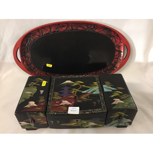 200A - BLACK LACQUERED AND PAINTED ORIENTAL MUSICAL JEWELLERY BOX AND RED LACQUERED TRAY