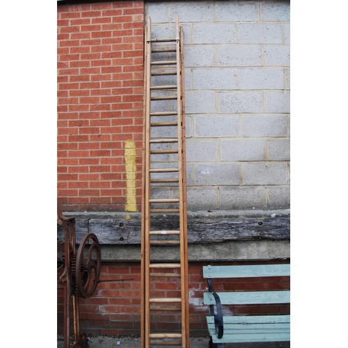 410 - PAIR OF WOODEN EXTENDING LADDERS