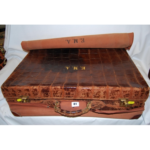 81 - VINTAGE CROCODILE EFFECT LEATHER SUITCASE WITH BRASS FITTINGS AND CANVAS COVER INITIALLED E.M.A.