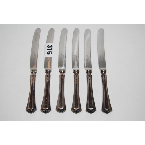 316 - SIX SILVER HAFTED DESSERT KNIVES; SHEFFIELD 1924