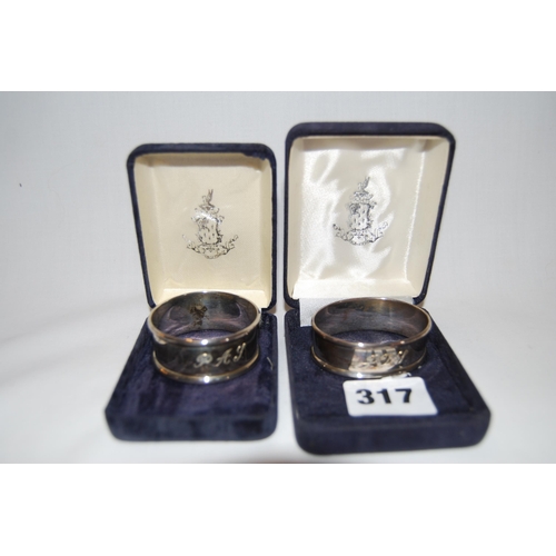 317 - 2 SILVER SERVIETTE RINGS INITIALLED P.A.S AND J.T.S; BIRMINGHAM 1962 AND 1965 (0.7ozs)