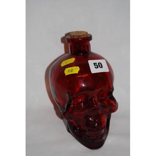 50 - RUBY GLASS SKULL BOTTLE