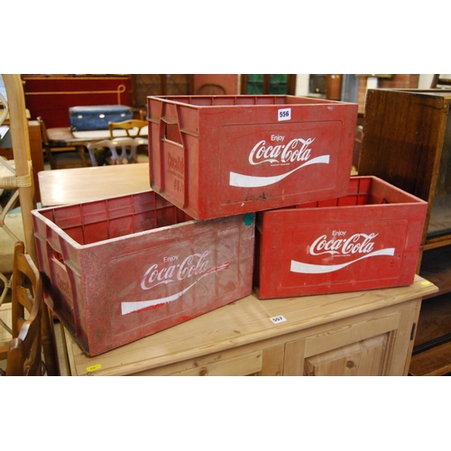 556 - 3 PLASTIC COCA COLA CRATES