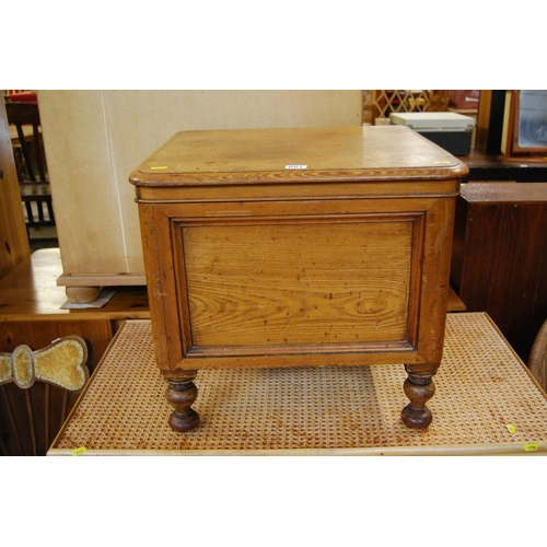 601 - VICTORIAN PINE BOX COMMODE WITH FOLDING ARM RESTS, ON TURNED SUPPORTS