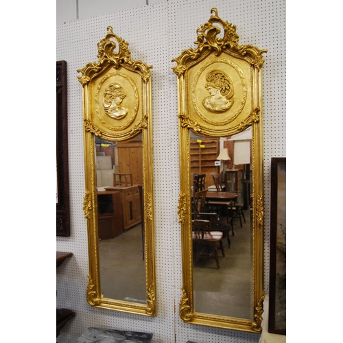 463 - PAIR OF CLASSICAL STYLE PIER GLASS MIRRORS WITH BEVELLED MIRRORS IN GILT FRAMES WITH MAIDEN HEADS AN... 