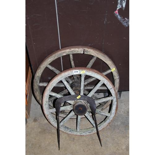 310 - TWO OLD CART WHEELS AND IRON BOOT SCRAPER