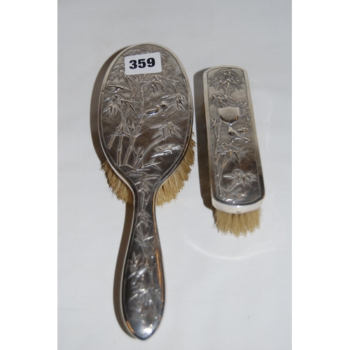 359 - CHINESE SILVER BACKED HAIRBRUSH AND CLOTHES BRUSH EMBOSSED BAMBOO AND BIRDS