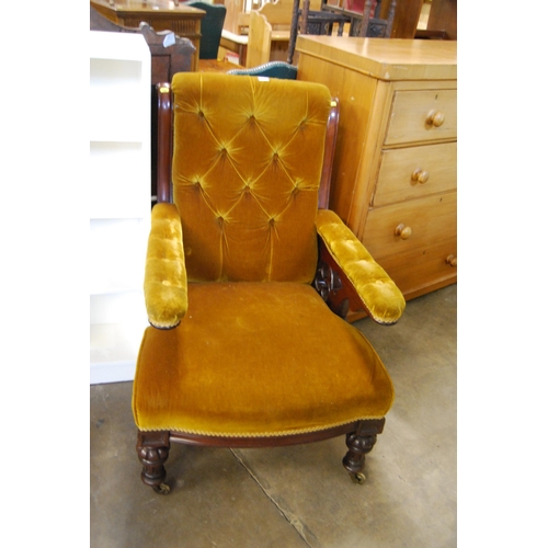 637 - 19TH CENTURY MAHOGANY LIBRARY CHAIR WITH BUTTON BACK, UPHOLSTERED IN GOLD VELVET, ON TURNED LEGS AND... 