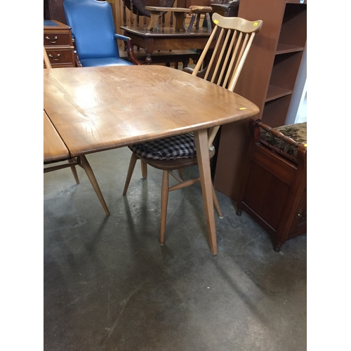 634 - ERCOL GOLDEN OAK EXTENDING DINING TABLE (2 SQUARE LEAVES) (MARKED TOP) AND SET OF 6 SPINDLE BACK DIN... 