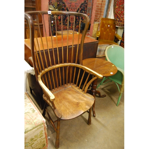 580 - 19TH CENTURY ELM WINDSOR COMB BACK EARCAP ARMCHAIR ON TURNED SUPPORTS