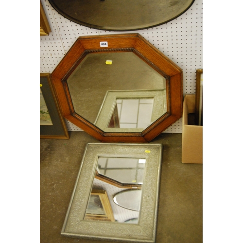 484 - EDWARDIAN OCTAGONAL OAK FRAMED WALL MIRROR AND EMBOSSED METAL WALL MIRROR