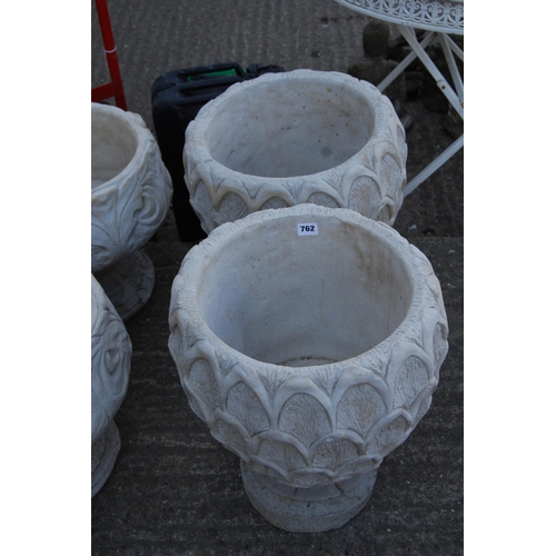 762 - PAIR OF LEAF PATTERN GARDEN URNS