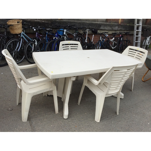 776 - WHITE PLASTIC GARDEN TABLE AND 4 CHAIRS