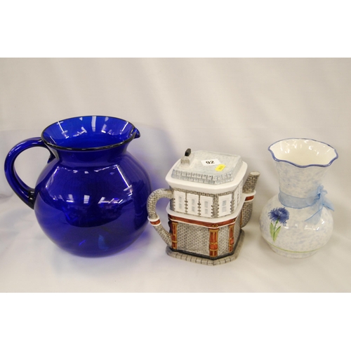 92 - LARGE BULBOUS BRISTOL BLUE GLASS WATER JUG, QUEEN VICTORIA TEAPOT AND CHINA VASE