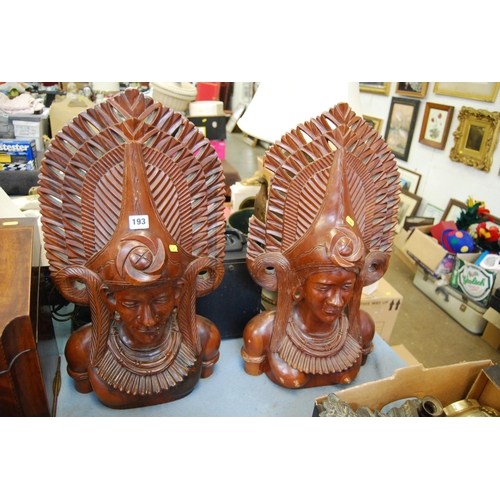 193 - PAIR OF HAND CARVED TEAK BALI JANGER BUSTS IN FULL HEADRESSES (64CM) (A/F)