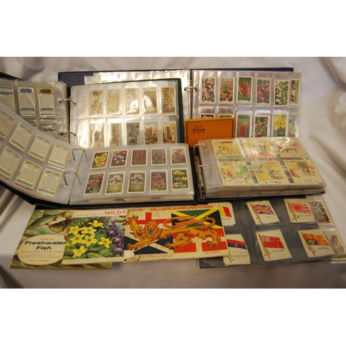 4 ALBUMS OF CIGARETTE CARDS INCLUDING SPORT, FISH, FLOWERS, CACTI ...