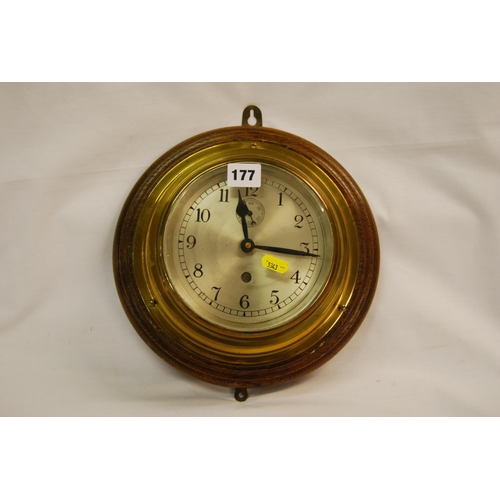 177 - MODERN BRASS BATTERY OPERATED BULK HEAD CLOCK