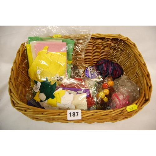 187 - CANE BASKET OF CRAFT ITEMS