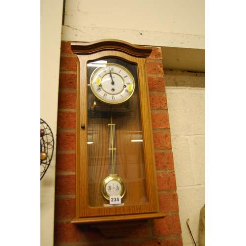 234 - MODERN OAK CASED WALL CLOCK