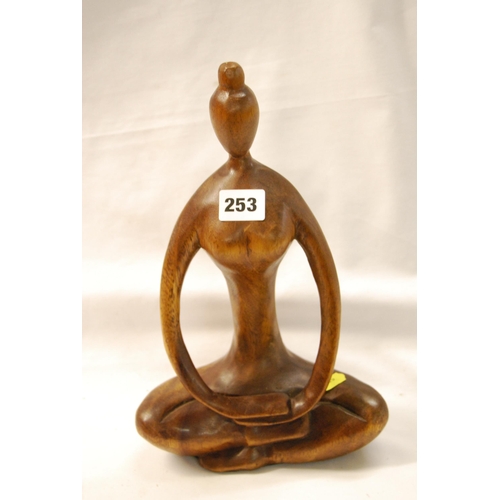 253 - STYLISTIC CARVED WOOD BUDDHA