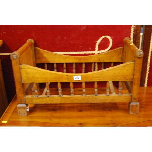 535 - 19TH CENTURY MAHOGANY DOLLS COT WITH TURNED GALLERY SIDES