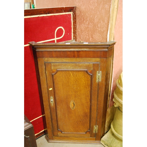 541 - GEORGIAN OAK CORNER CUPBOARD FITTED 3 SHELVES ENCLOSED BY PANEL DOOR WITH INLAID SHELL CARTOUCHE