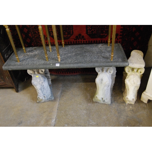 573 - GRANITE TOP GARDEN BENCH ON 3 STONEWARE HORSE HEAD SUPPORTS