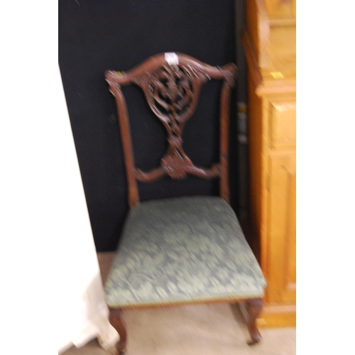 576 - LATE VICTORIAN RICHLY CARVED MAHOGANY NURSING CHAIR